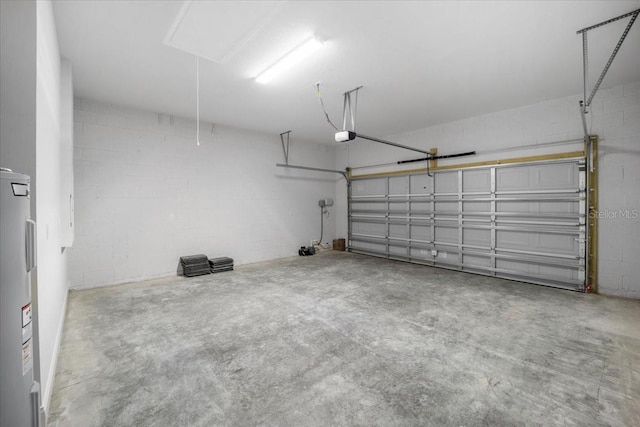 garage with electric water heater and a garage door opener