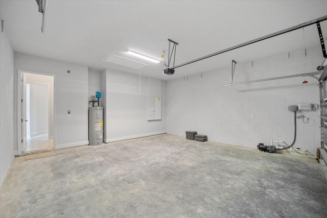 garage with a garage door opener and electric water heater