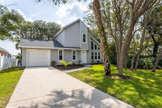 view of front of house with a garage and a front yard