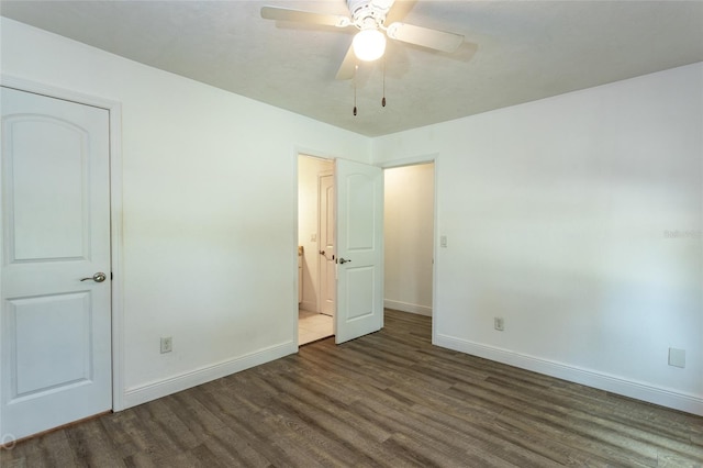 unfurnished bedroom with dark wood-type flooring and ceiling fan