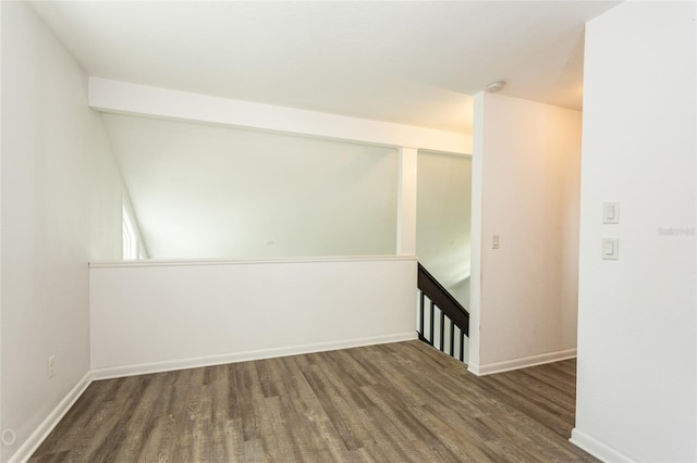 empty room with dark hardwood / wood-style floors