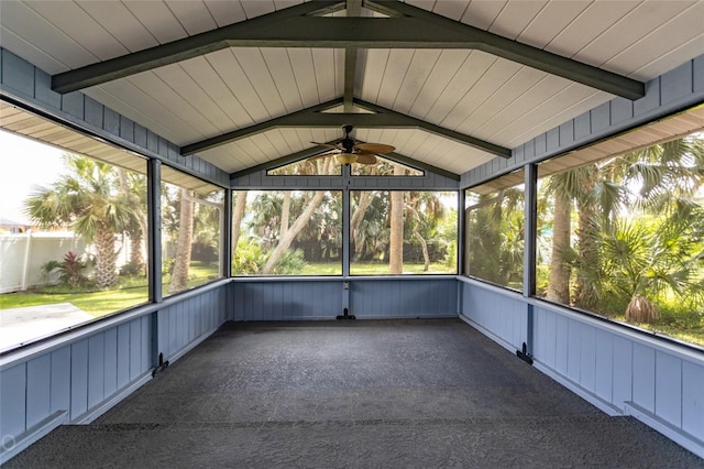 unfurnished sunroom with lofted ceiling with beams and ceiling fan