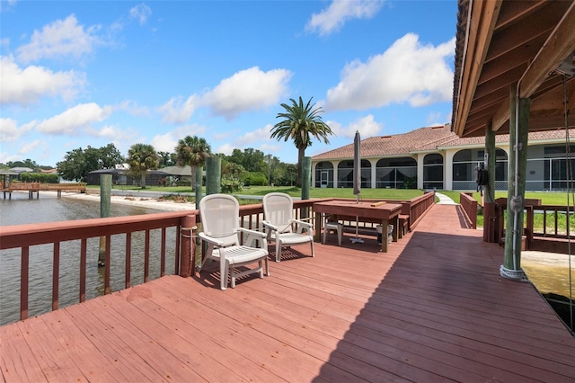 wooden deck featuring a water view