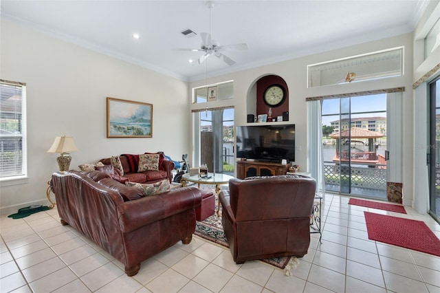 living room featuring ornamental molding, light tile patterned flooring, and visible vents