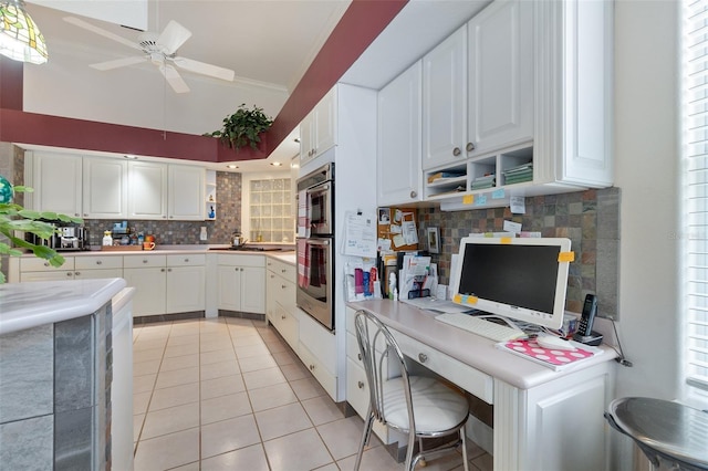 6 Valencia St, Palm Coast, FL 32137 - kitchen with a ceiling fan, backsplash, a desk, light tile patterned flooring, and white cabinets