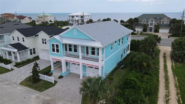 drone / aerial view with a water view