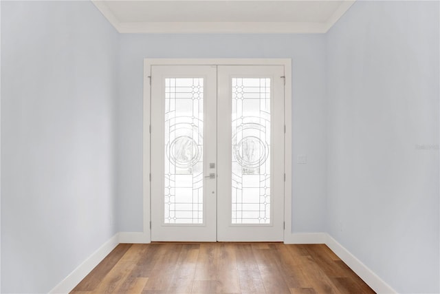 entryway with wood-type flooring, baseboards, and french doors