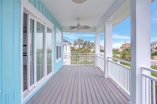 wooden deck with a ceiling fan