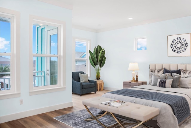 bedroom featuring recessed lighting, baseboards, and wood finished floors