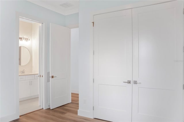 closet featuring a sink and visible vents