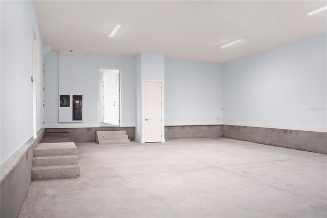 spare room with concrete flooring