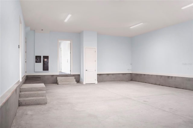 spare room with concrete floors