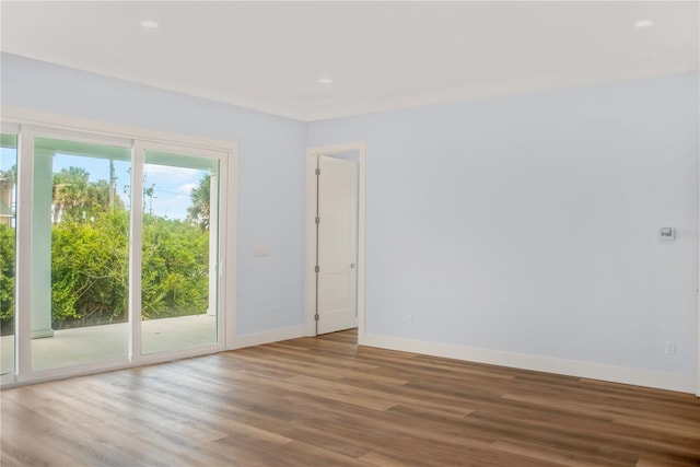 empty room with hardwood / wood-style floors