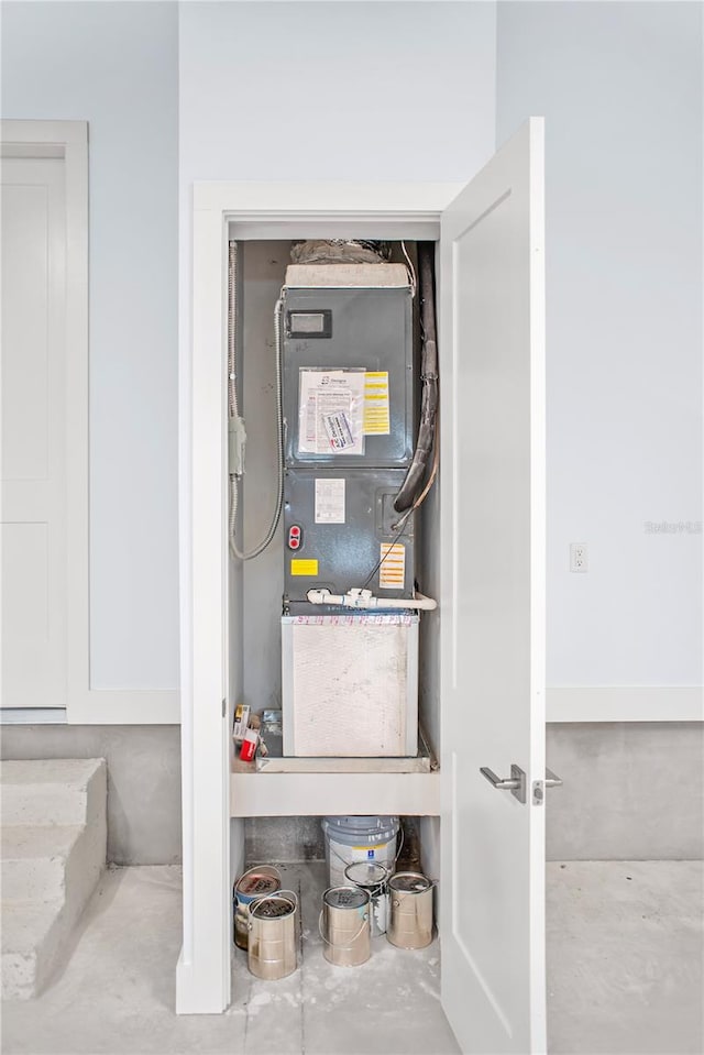 utility room with heating unit