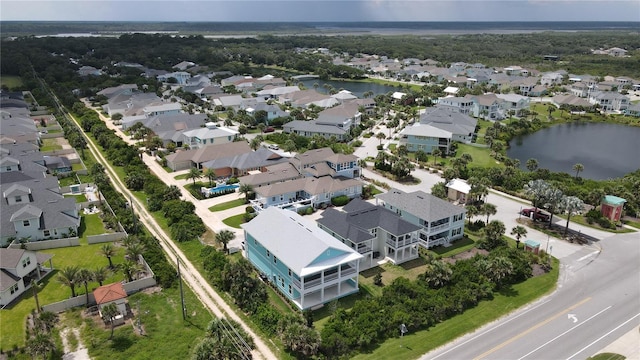 birds eye view of property with a residential view and a water view
