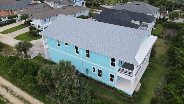 birds eye view of property with a residential view