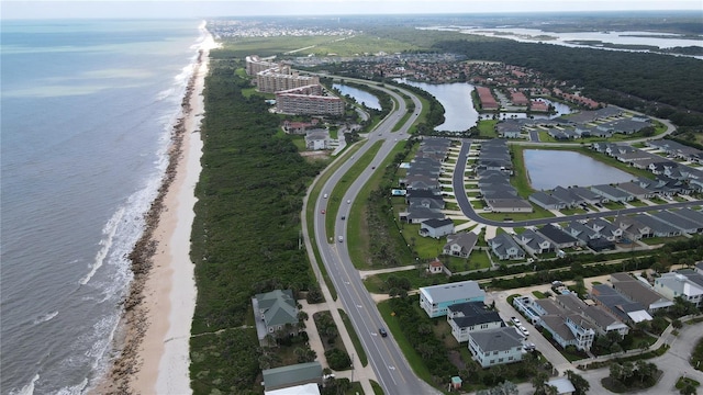 birds eye view of property with a water view, a residential view, and a view of the beach