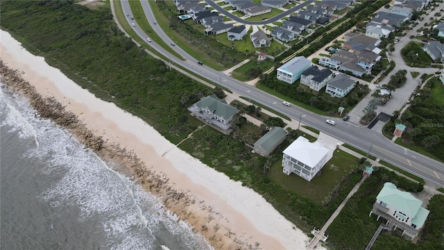 bird's eye view with a water view, a residential view, and a view of the beach