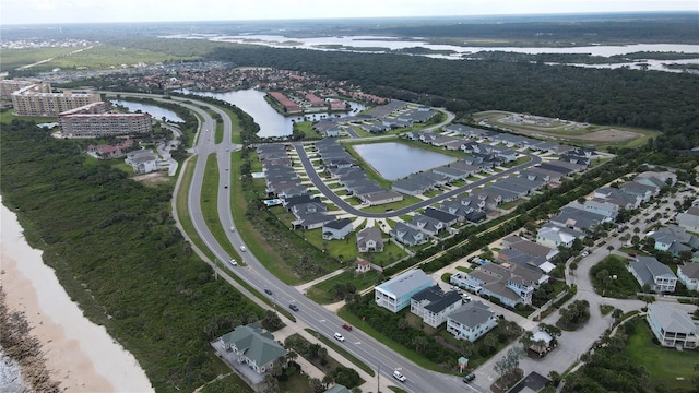 drone / aerial view featuring a water view and a residential view