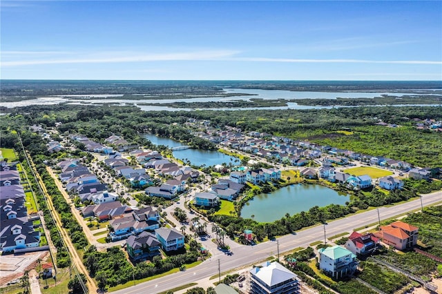 bird's eye view with a water view and a residential view
