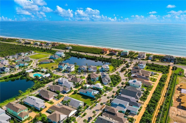 drone / aerial view featuring a water view and a residential view