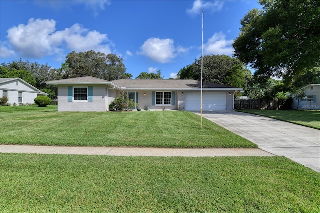 ranch-style house with a front lawn and a garage