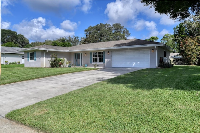 ranch-style house with concrete driveway, a garage, and a front lawn