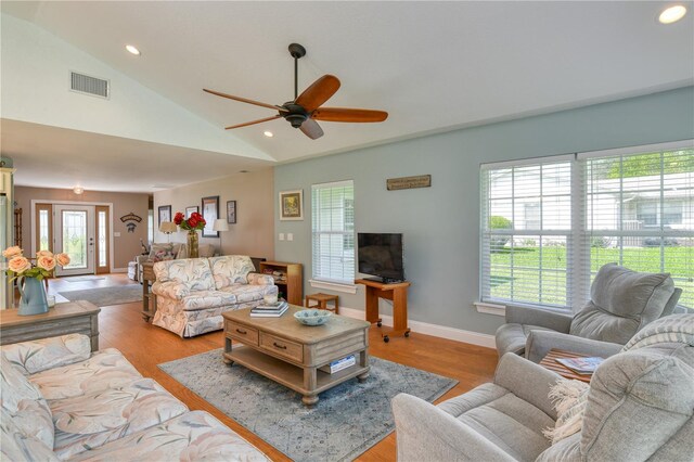 living area featuring recessed lighting, visible vents, a healthy amount of sunlight, and light wood-style flooring