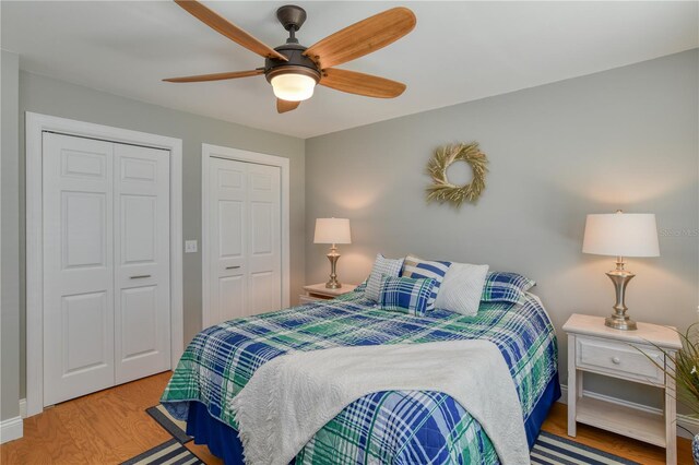 bedroom featuring wood finished floors and a ceiling fan