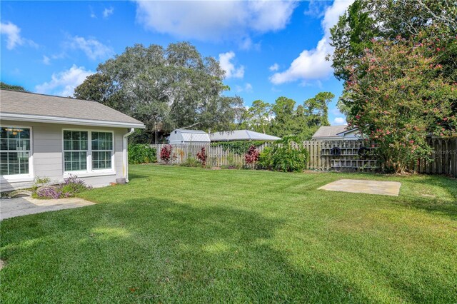 view of yard featuring a fenced backyard