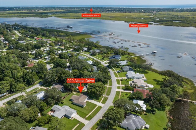 birds eye view of property with a residential view and a water view