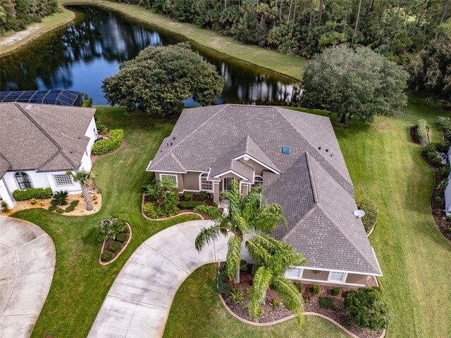 birds eye view of property with a water view