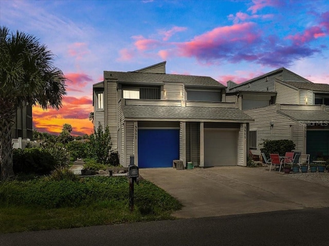 view of front facade featuring concrete driveway