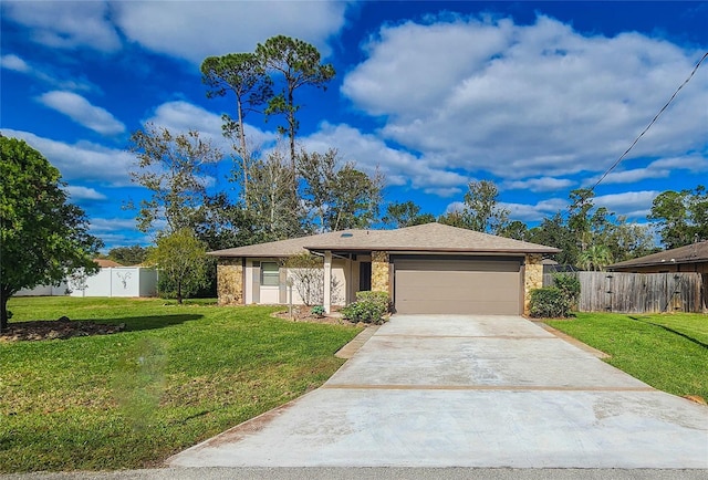 view of front of house featuring a front lawn and a garage