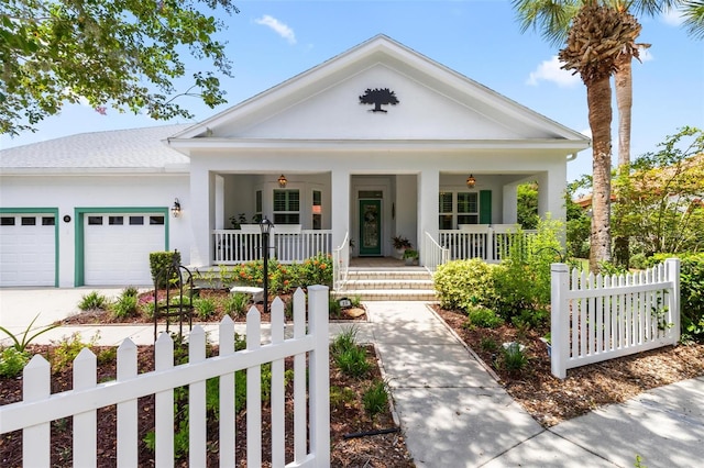 neoclassical home with ceiling fan, a porch, and a garage