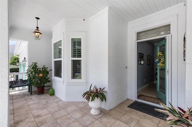 doorway to property featuring covered porch