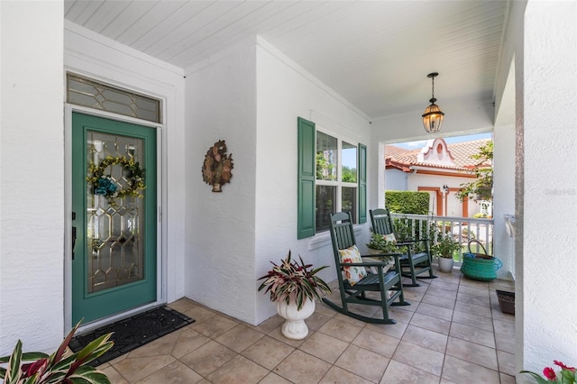 doorway to property with a porch