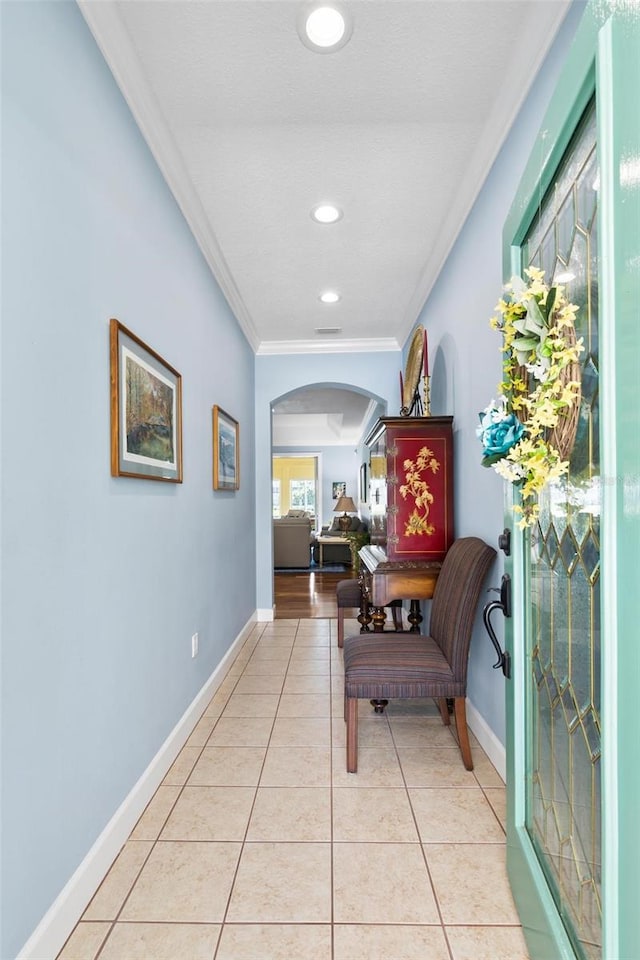 corridor featuring light hardwood / wood-style flooring and ornamental molding