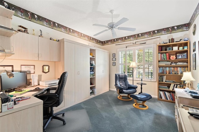 home office with ceiling fan, a textured ceiling, and carpet floors