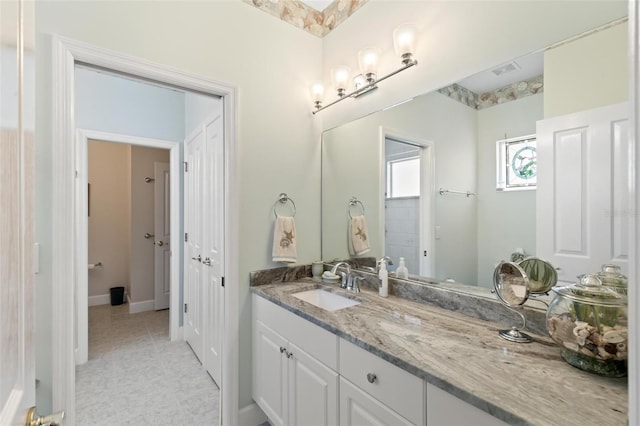 bathroom with vanity and tile patterned flooring