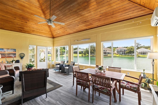 sunroom featuring vaulted ceiling, ceiling fan, wooden ceiling, a water view, and a wealth of natural light