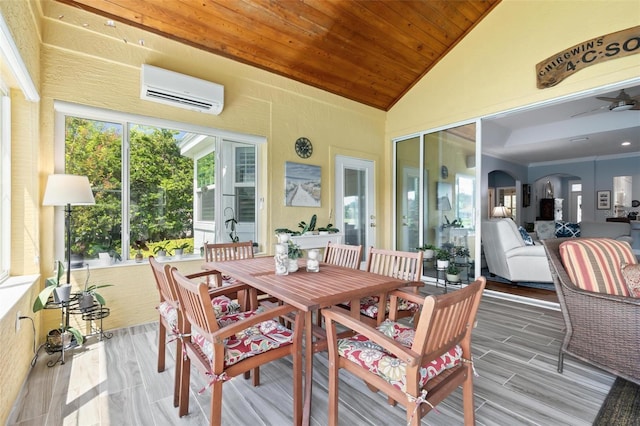 sunroom / solarium with ceiling fan, lofted ceiling, a wall unit AC, and wood ceiling