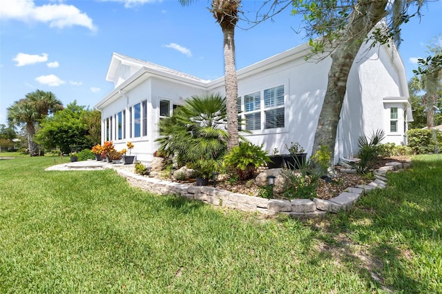 view of home's exterior with a yard