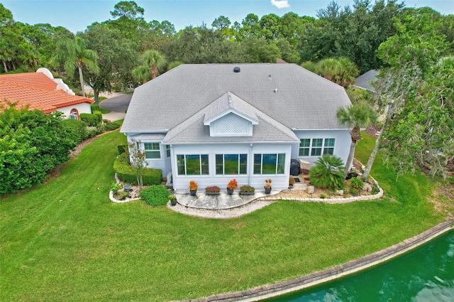 back of house featuring a yard