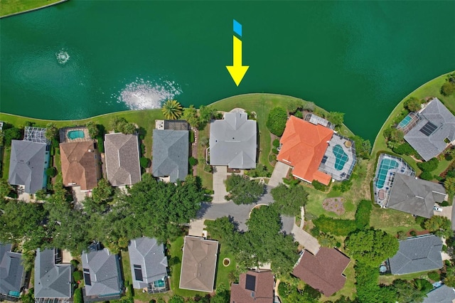 birds eye view of property with a water view