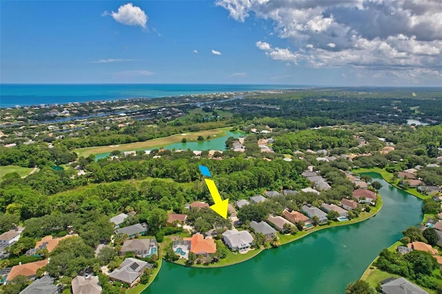 birds eye view of property featuring a water view