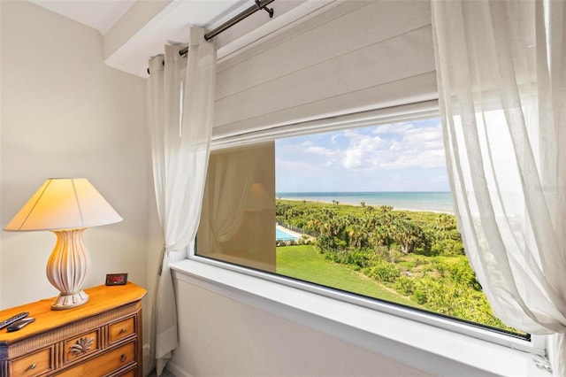 interior space featuring multiple windows and a water view