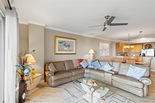 living room featuring ceiling fan with notable chandelier, light hardwood / wood-style flooring, and ornamental molding