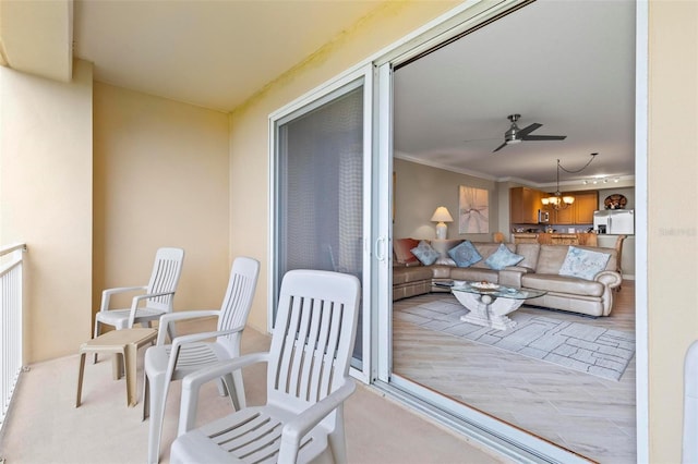 balcony featuring ceiling fan