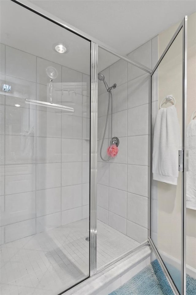 bathroom featuring an enclosed shower